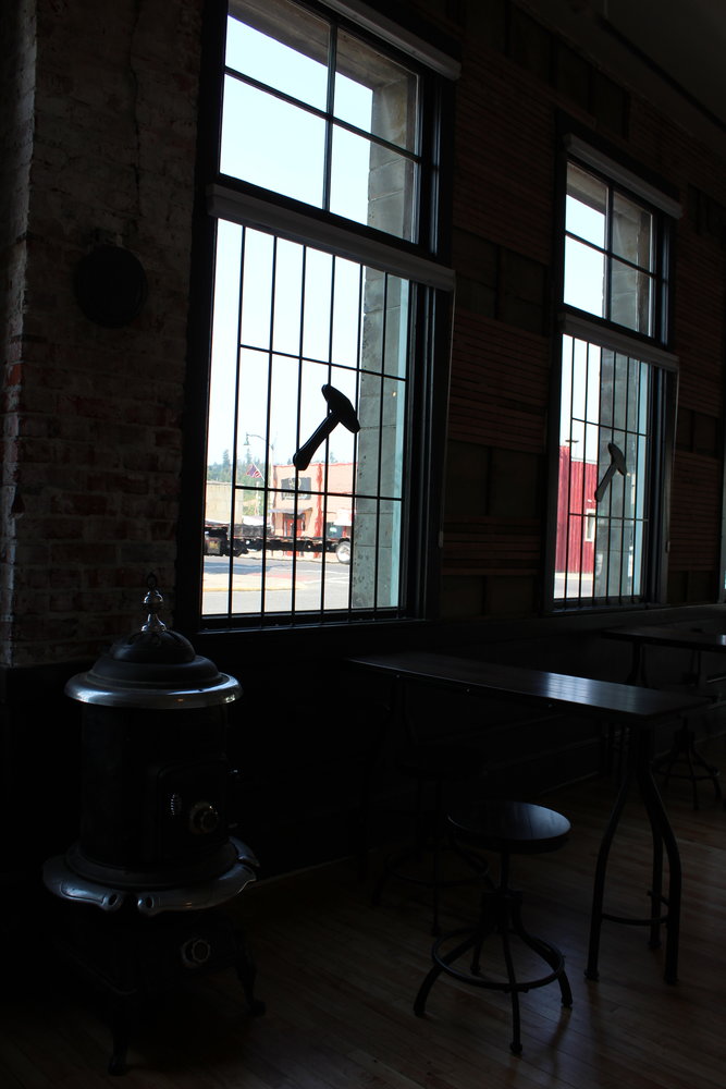 A seating area in the new downtown Tenino Sandstone Distillery tasting room. Many of the windows were installed in the building in 1914 and some had been covered since the 1950s.